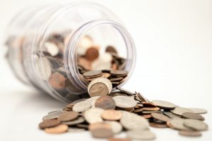 Money spilling from a jar