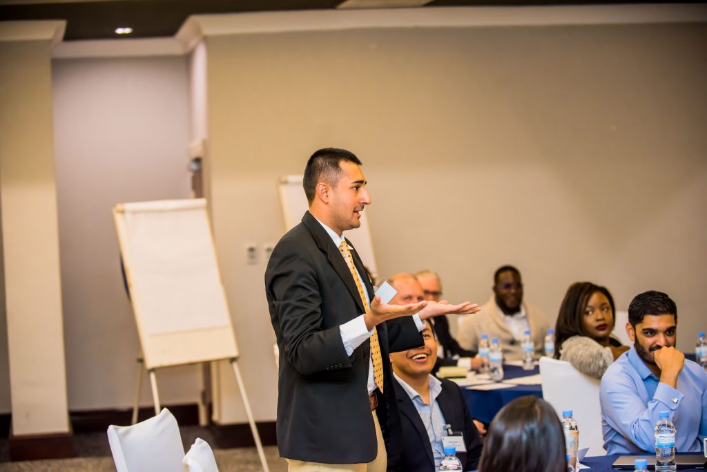 Lawyer presenting in front of participants at the Oxford Policy Fellowship Annual Meeting