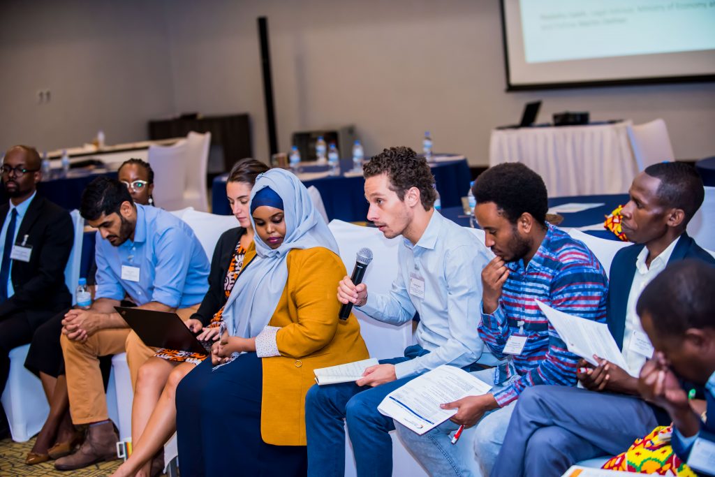 Oxford Policy Fellow presenting to participants at the Annual Meeting